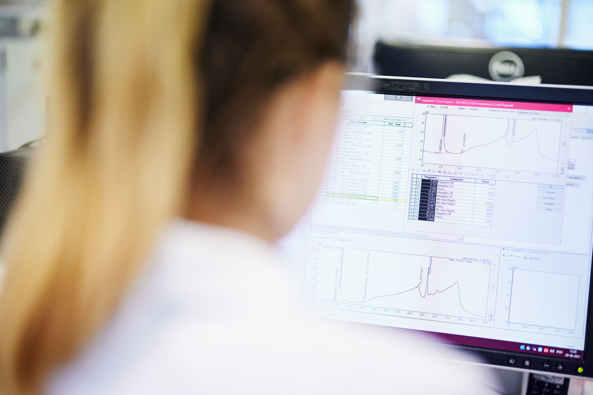 Woman conducting quality assurance and GMP compliance at Ofichem CDMO